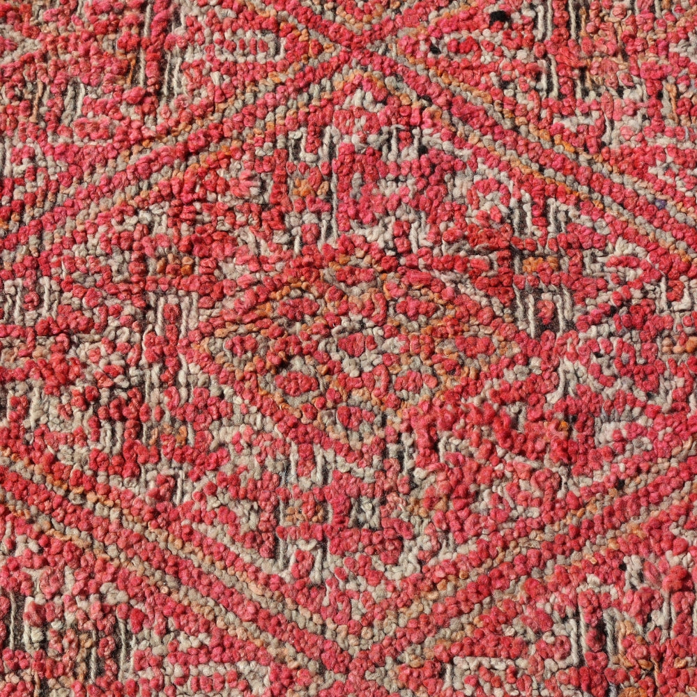 Close up of vintage Boujaad wool rug showing textured pile and faded geometric motifs