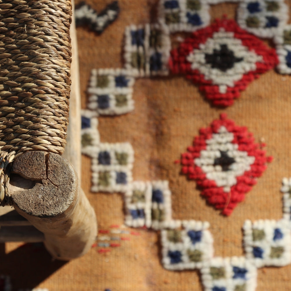 Textured details and raised knots on artisan Moroccan flatweave rug