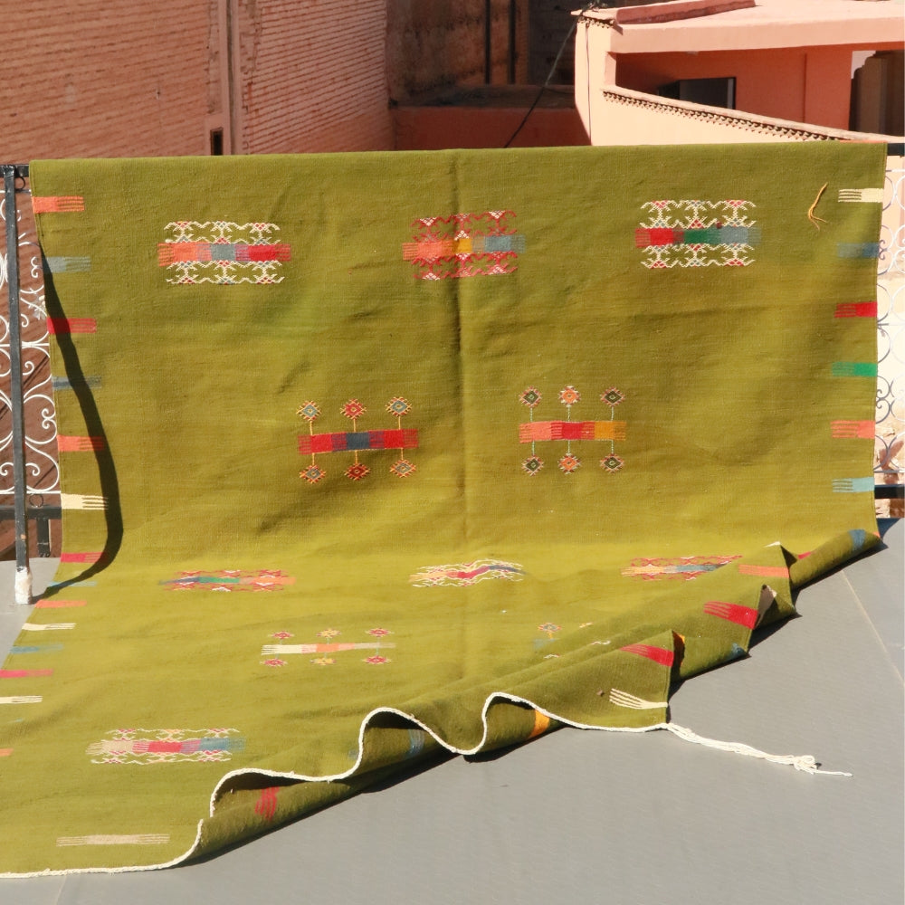 Moroccan Aknif flatweave rug in olive green wool with hand embroidered motifs