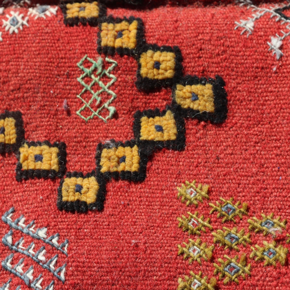 Close-up of triple embroidery technique on a Red Moroccan Aknif flatweave rug