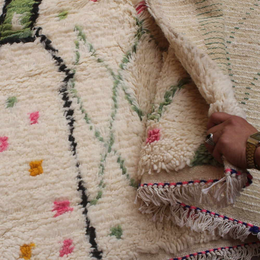 Handmade Moroccan Azilal rug with artistic motifs