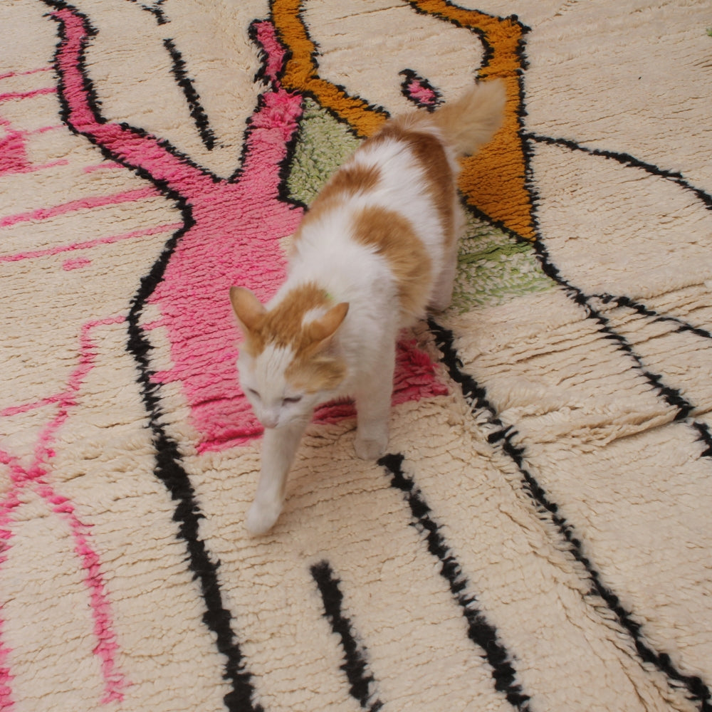 Traditional Moroccan Azilal rug with bright tribal patterns