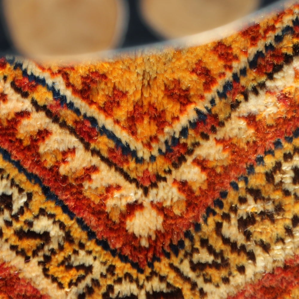 Moroccan Berber rug folded showing thickness and quality