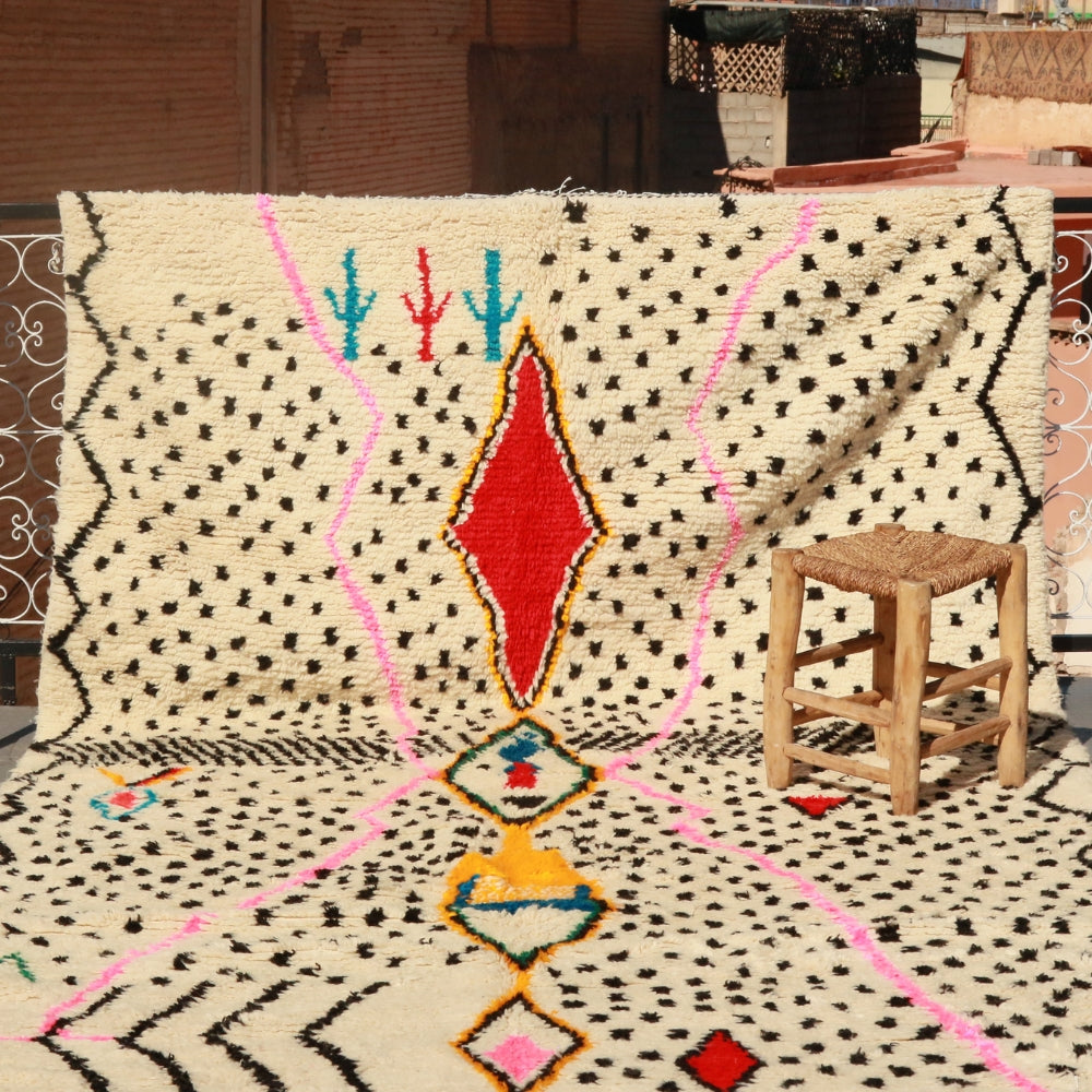Azilal rug handwoven in Morocco with graphic Berber symbols and colorful wool