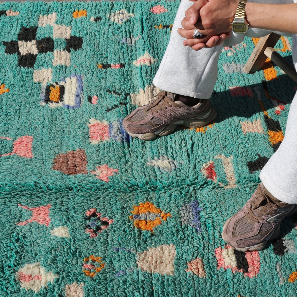 Handwoven Azilal rug styled in a contemporary interior, showcasing vibrant Moroccan wool patterns