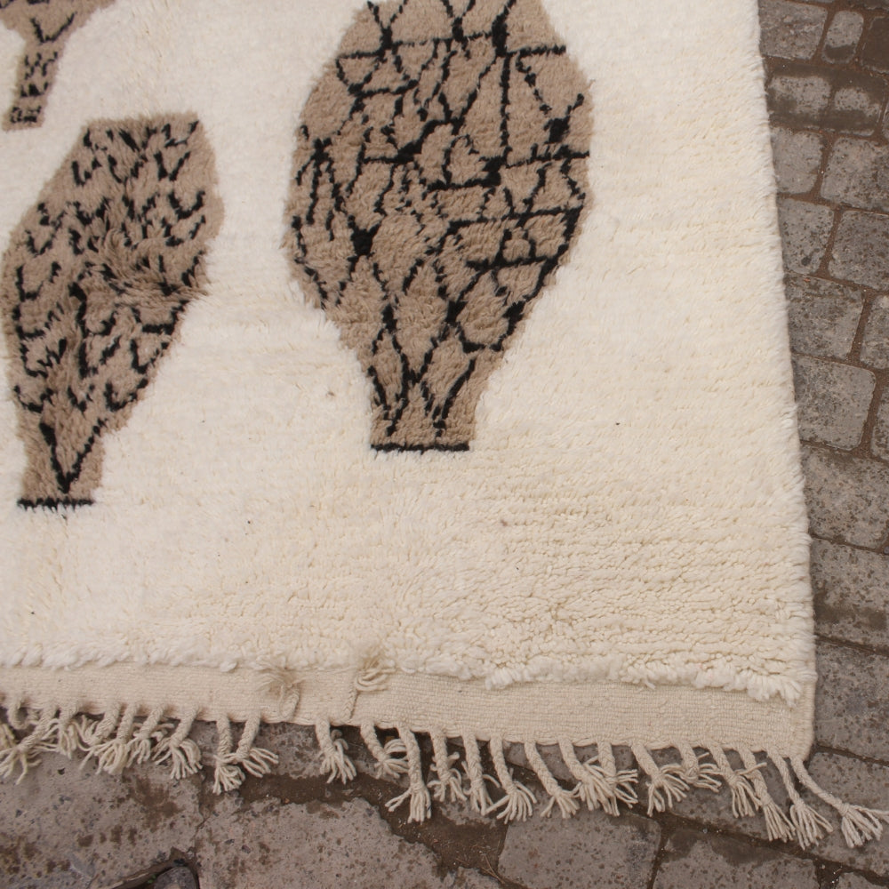Handmade Beni Ouarain carpet with tribal patterns