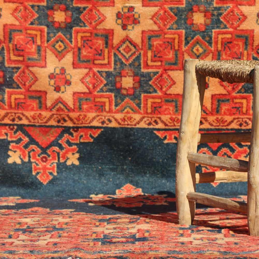 Vintage Moroccan Taznakht rug handwoven in wool with red and black Berber geometric patterns