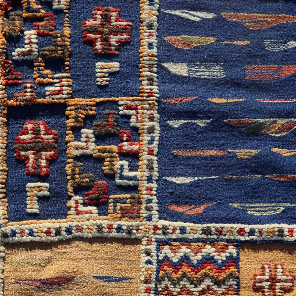 Abstract geometric motifs on handwoven Taznakht Berber Picasso rug with vibrant wool details