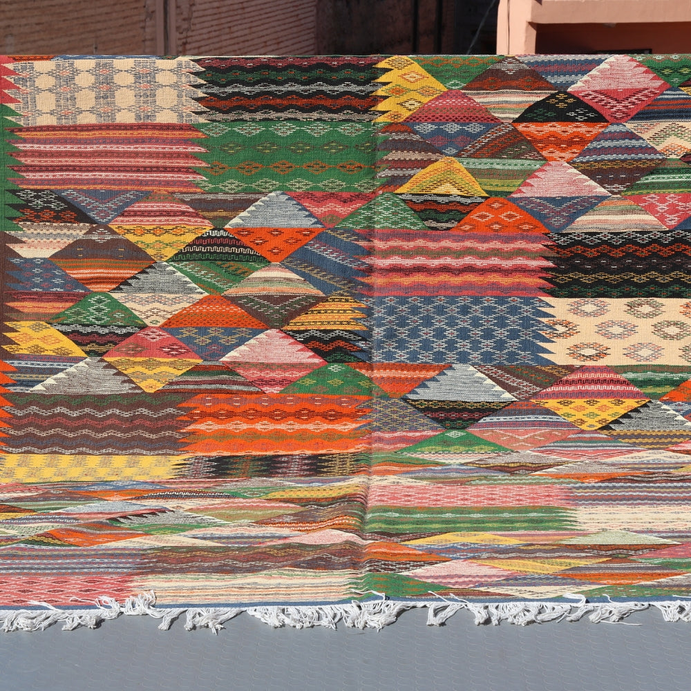 Taznakht flatweave rug handwoven in Morocco with colorful Berber geometric patterns