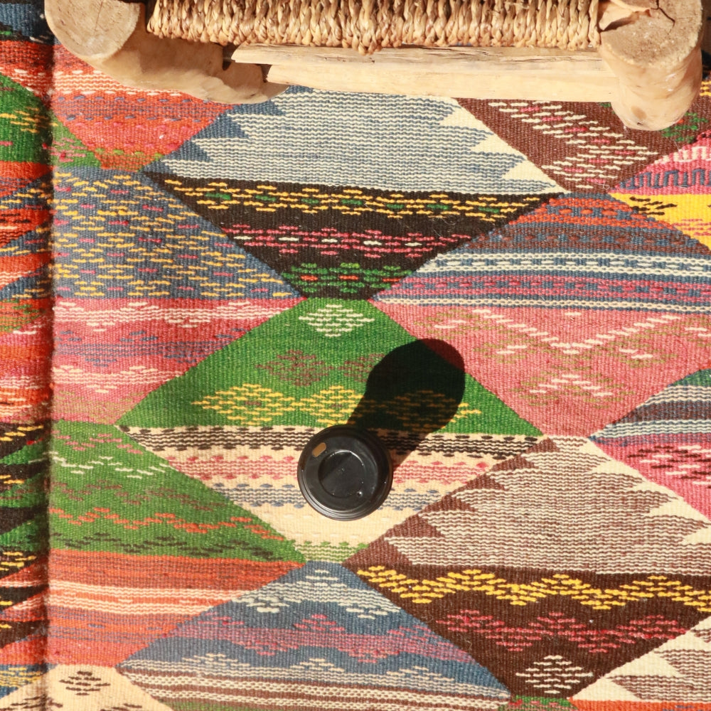 Close up of handwoven Taznakht rug showing intricate Berber geometry