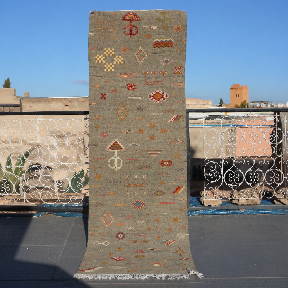 Tribal Akhnif Moroccan rug with handwoven Berber motifs in earthy wool tones