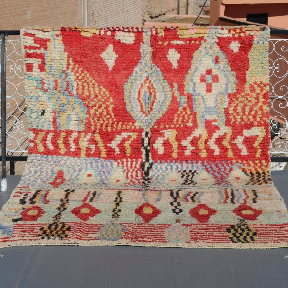Vintage Azilal Berber rug handwoven in Morocco with bold geometric patterns and natural wool