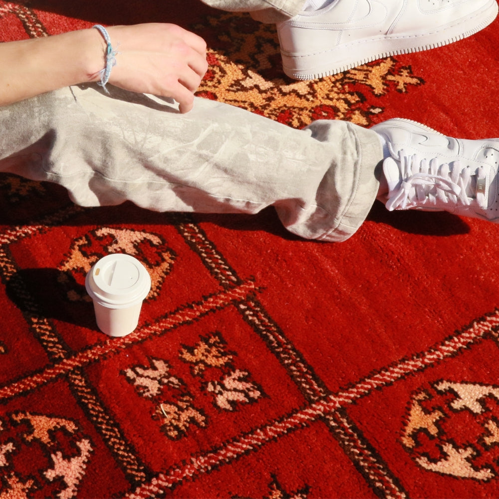 Detail of geometric patterns on red vintage Beni M’Guild rug