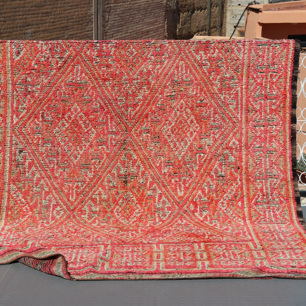Vintage Boujaad rug handwoven in Morocco, red wool pile with geometric Berber patterns
