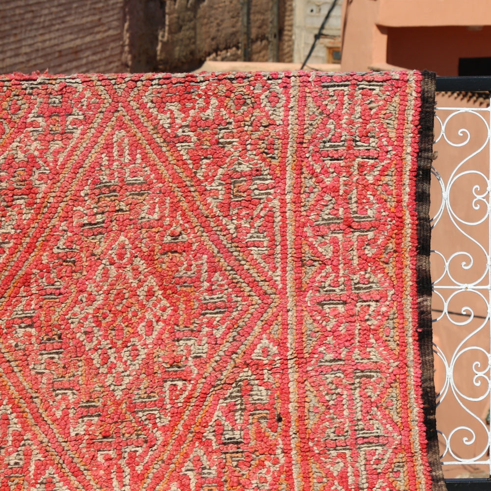 Close up of vintage Boujaad wool rug on the aged wool patina and handwoven irregular patterns