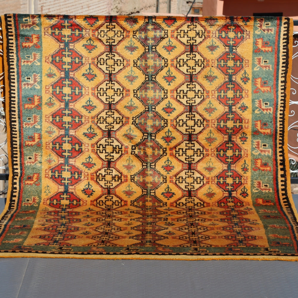 Vintage Tazenakht Berber rug handwoven in Morocco with geometric patterns and warm natural wool tones