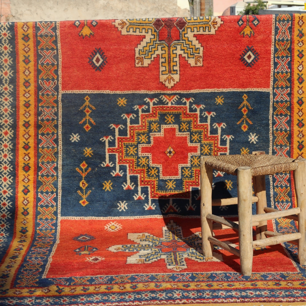 Vintage Taznakht rug handwoven in Morocco with indigo blue and saffron yellow wool