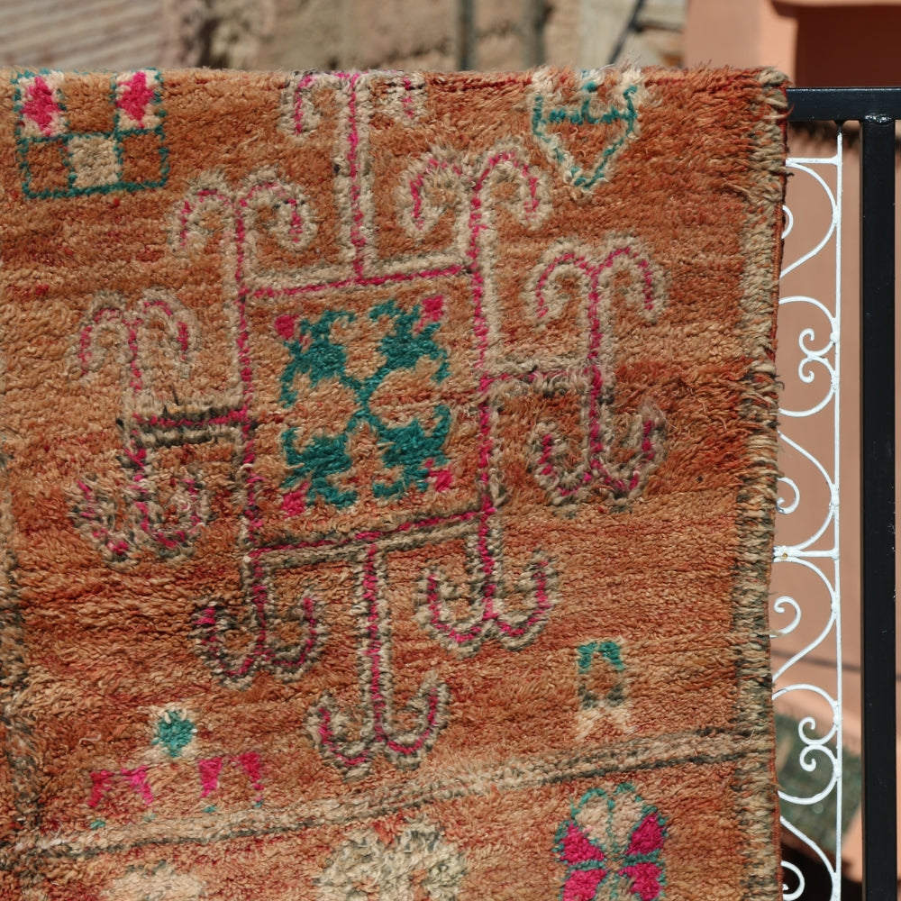 Close up of vintage Boujaad rug showing handwoven wool texture and tribal Moroccan motifs