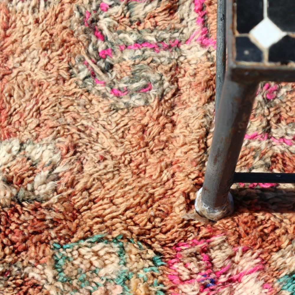 Detail of aged wool pile on vintage Moroccan Boujaad rug with natural patina