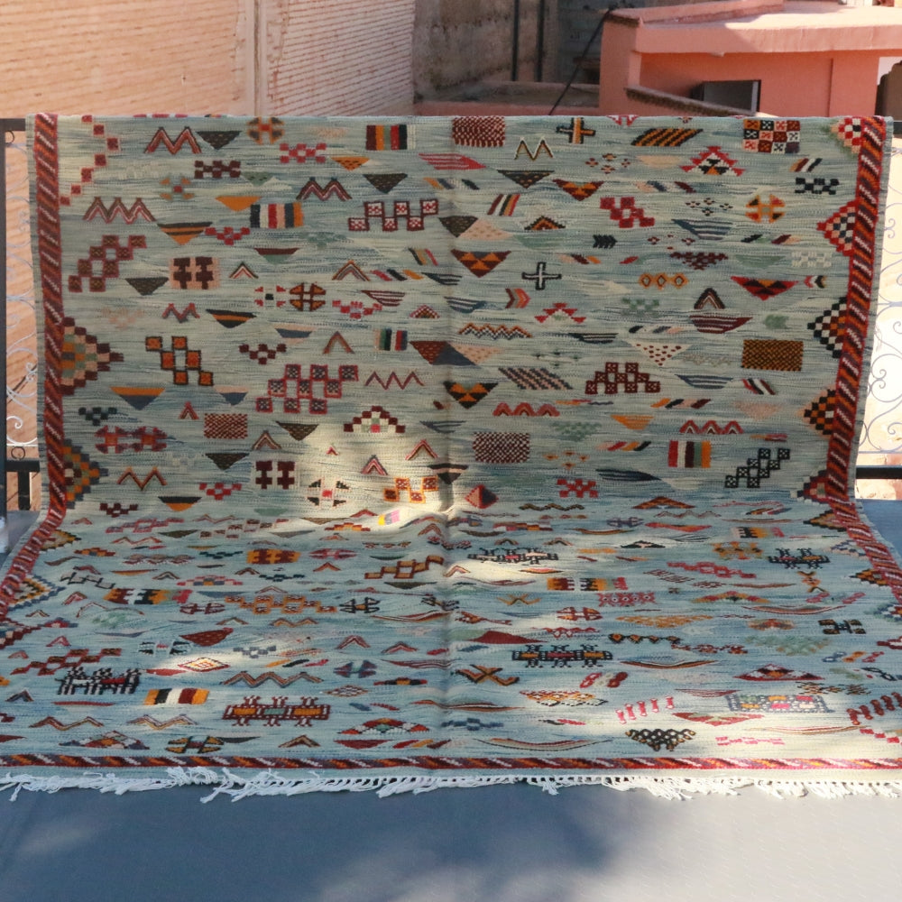 Handwoven grey Akhnif Berber rug with embroidered geometric motifs