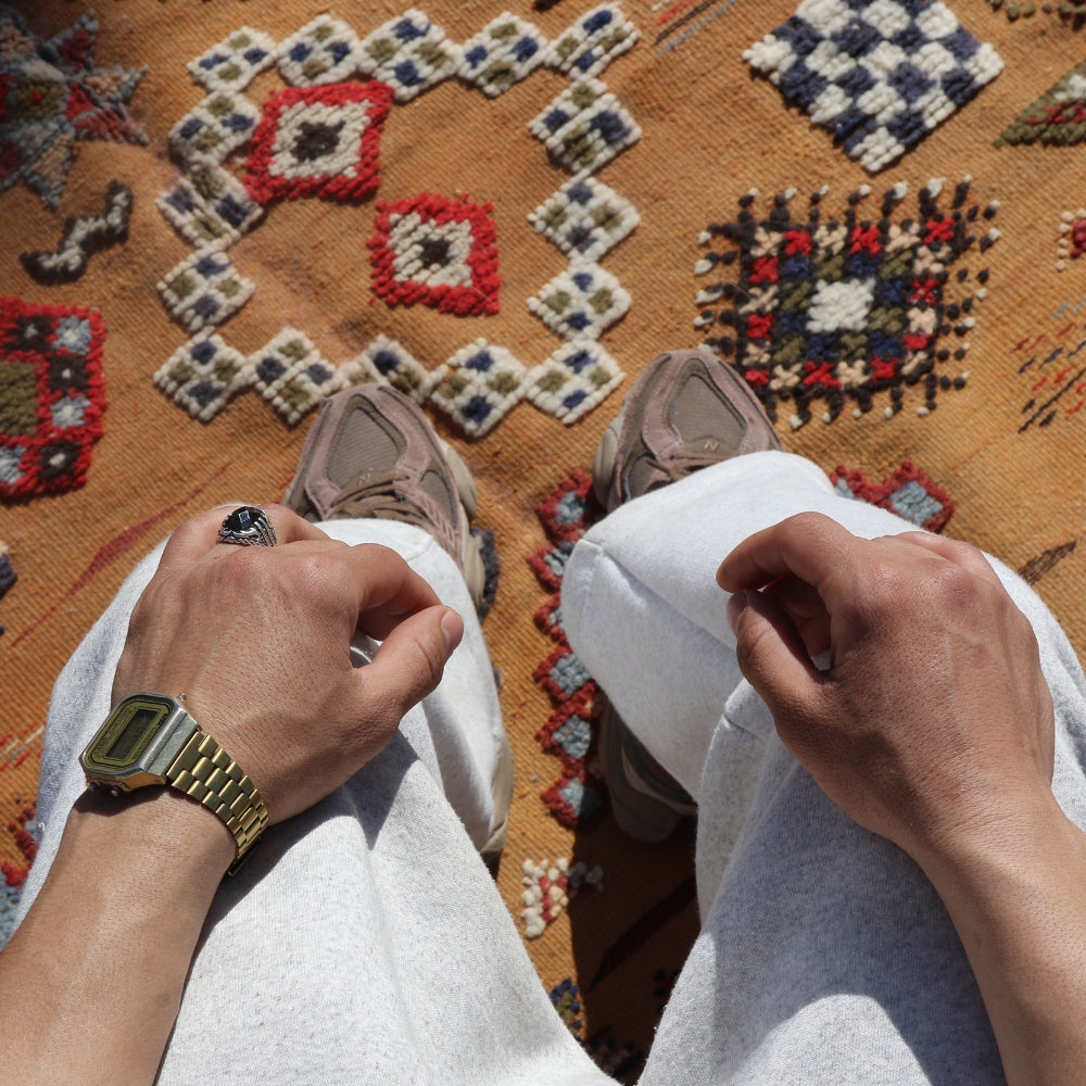 Close up of hand embroidery on Moroccan Akhnif flatwoven rug