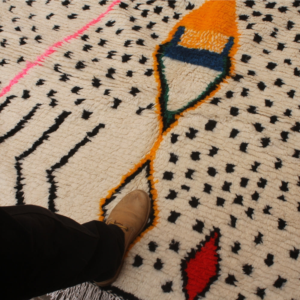 Handmade Azilal rug with colorful geometric patterns
