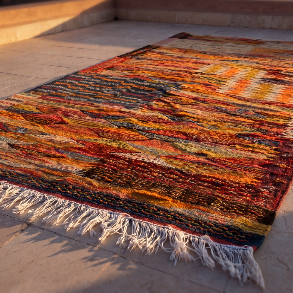 Vintage-inspired Taznakht flatweave rug featuring bold abstract Moroccan motifs and warm earthy palette