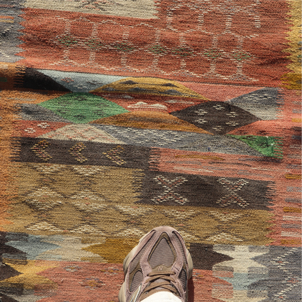 Detailed wool texture of colorful Moroccan Berber rug with abstract tribal motifs