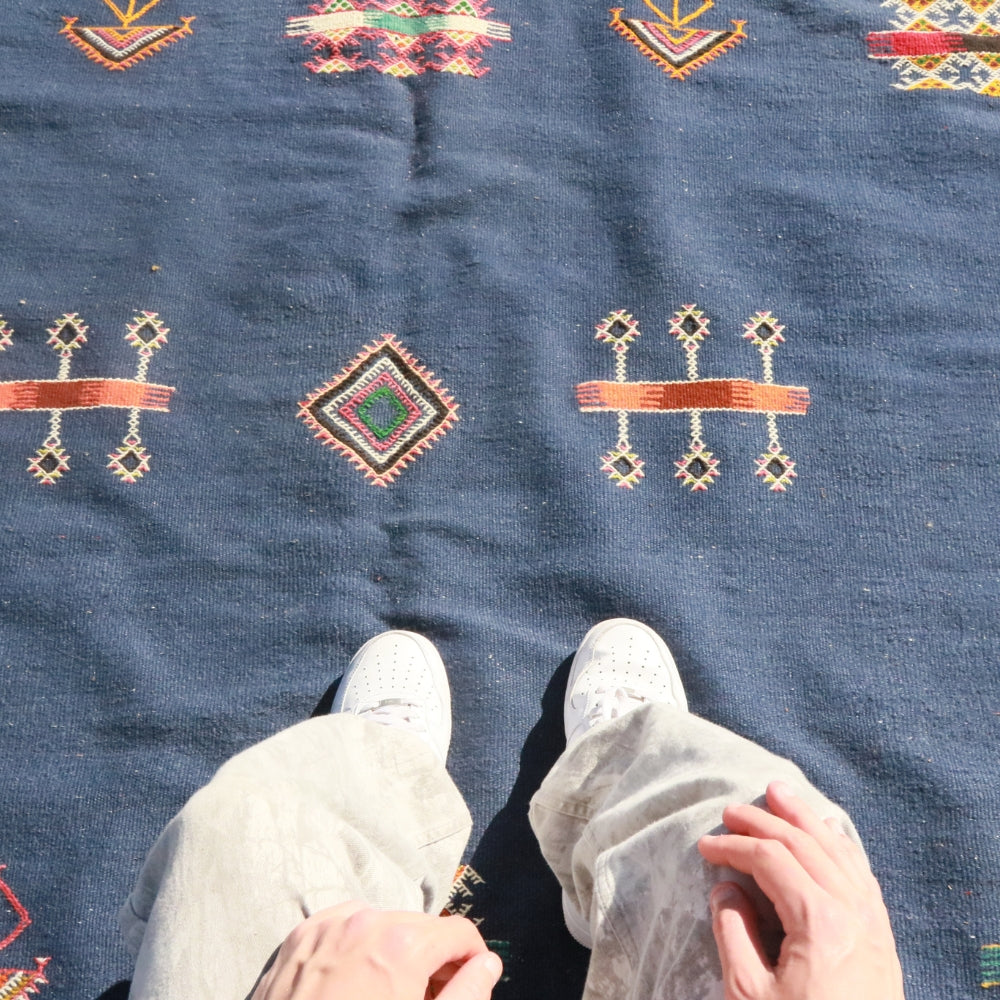 Close up of embroidered Berber motifs on Aknif flatweave wool rug