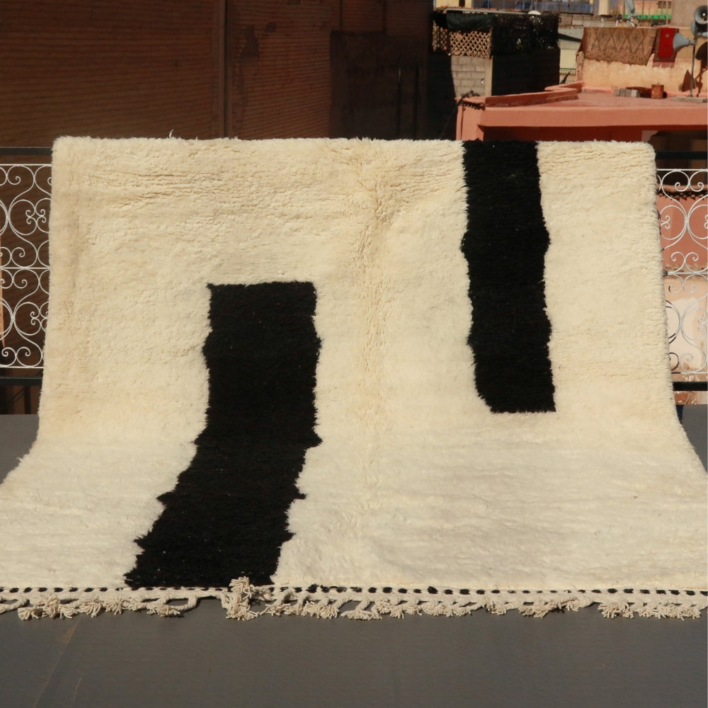 Beni Ourain rug handwoven in Morocco, ivory wool with bold black minimalist lines