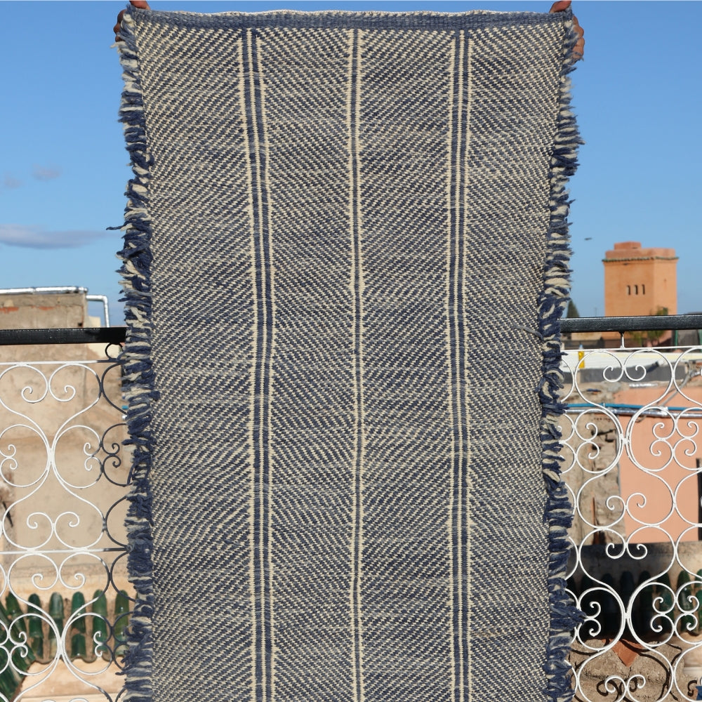 Minimalist Moroccan Berber rug, handwoven neutral wool flatweave carpet with subtle linear pattern