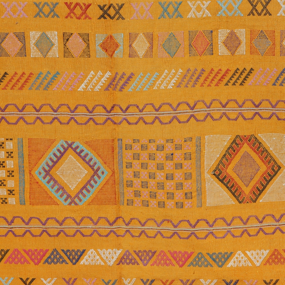Close up on a moroccan Sabra rug with traditional Berber motifs, handmade flatweave textile