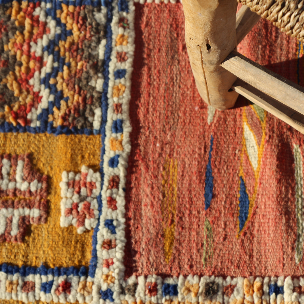 Close-up of colorful Berber Picasso wool rug showcasing textured Moroccan artisan weaving