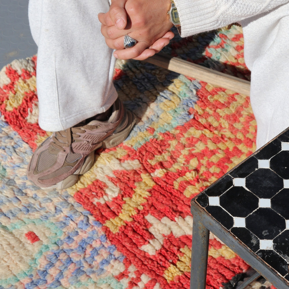Close-up of a vintage Moroccan Azilal rug showing expressive Berber symbols in handwoven wool