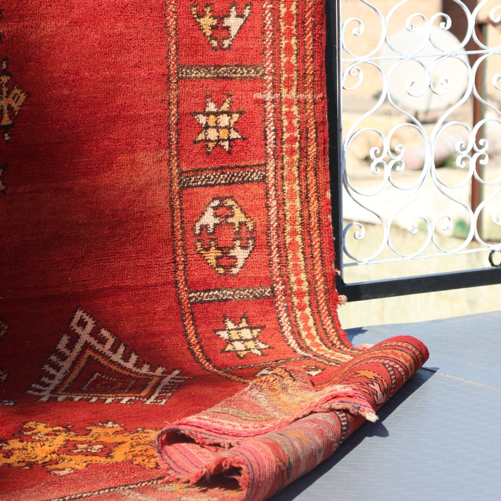 Vintage red Beni M’Guild rug with traditional Berber geometric motifs